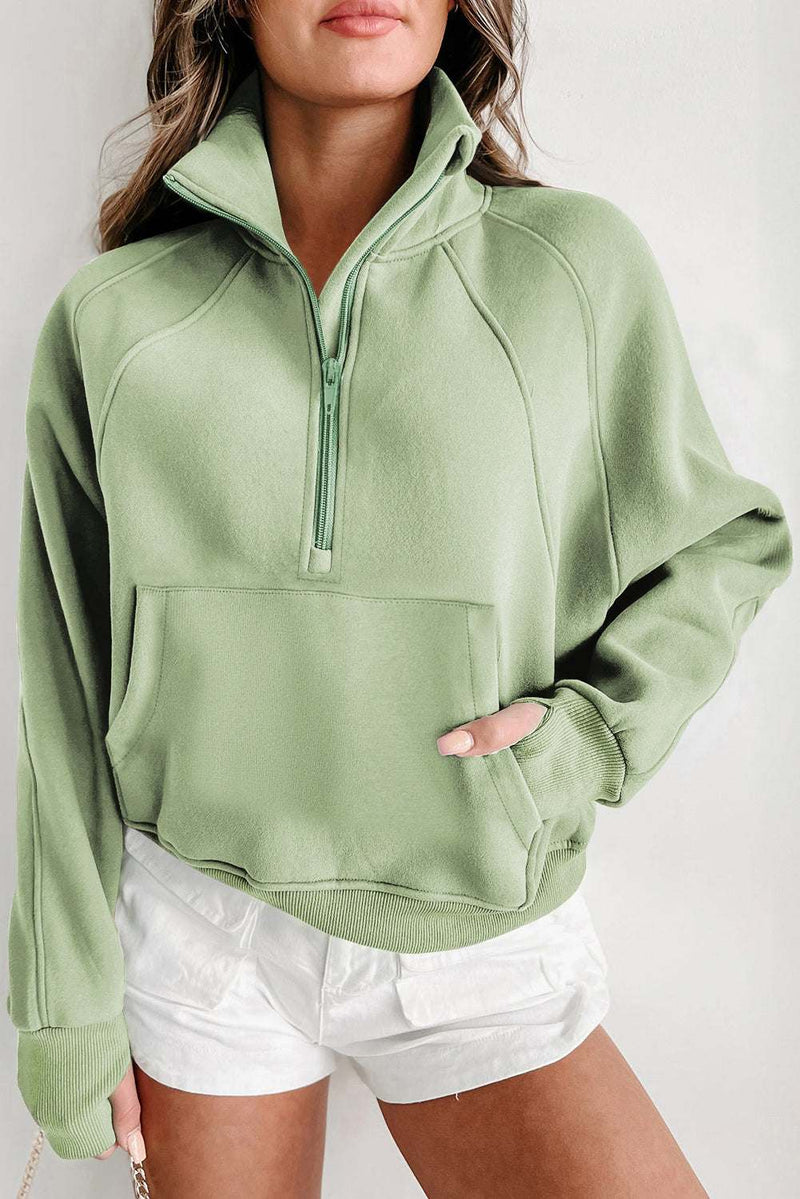 Fleece lined zip up sweatshirt with stand collar and thumbhole sleeves.