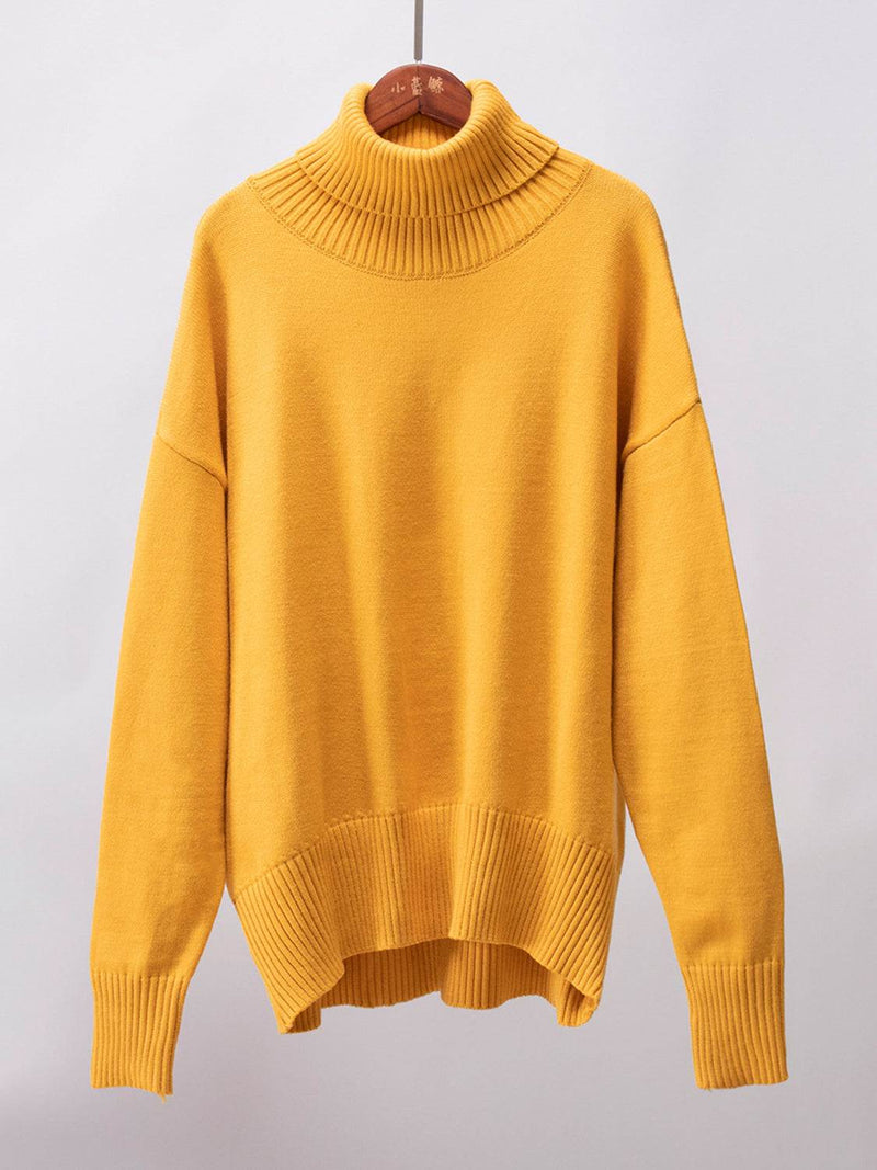 Yellow turtleneck long sleeve sweater with ribbed collar and hem.