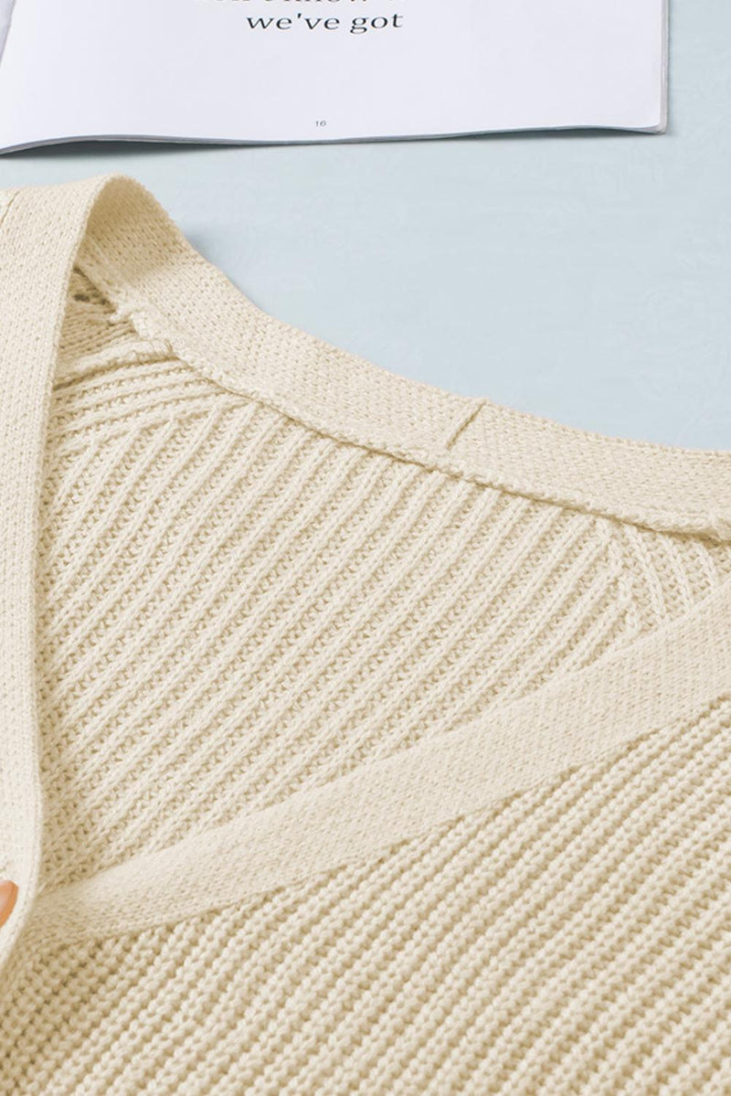 Openwork V-neck button-up cardigan in beige, 100% acrylic.