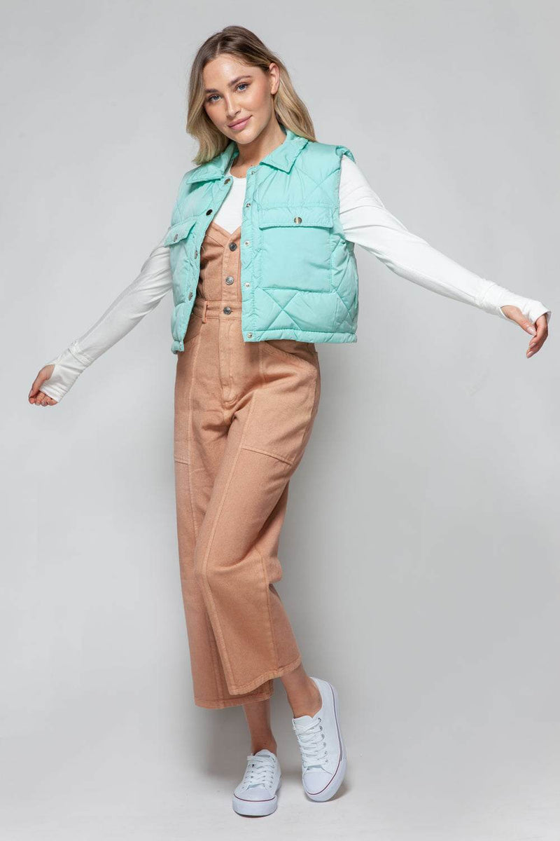 Snobbish Snap Down Quilted Crop VestThe snap-down quilted crop vest is a stylish and versatile addition to your wardrobe. With its snap-button closure and cropped length, this vest offers a modern and OuterwareTrendsiKlondike Creek Unique BoutiqueQuilted Crop Vest