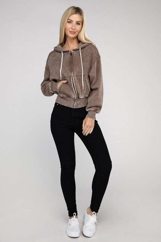 Acid wash fleece cropped zip-up hoodie with drawstring hood, worn by model with long sleeves and two pockets.