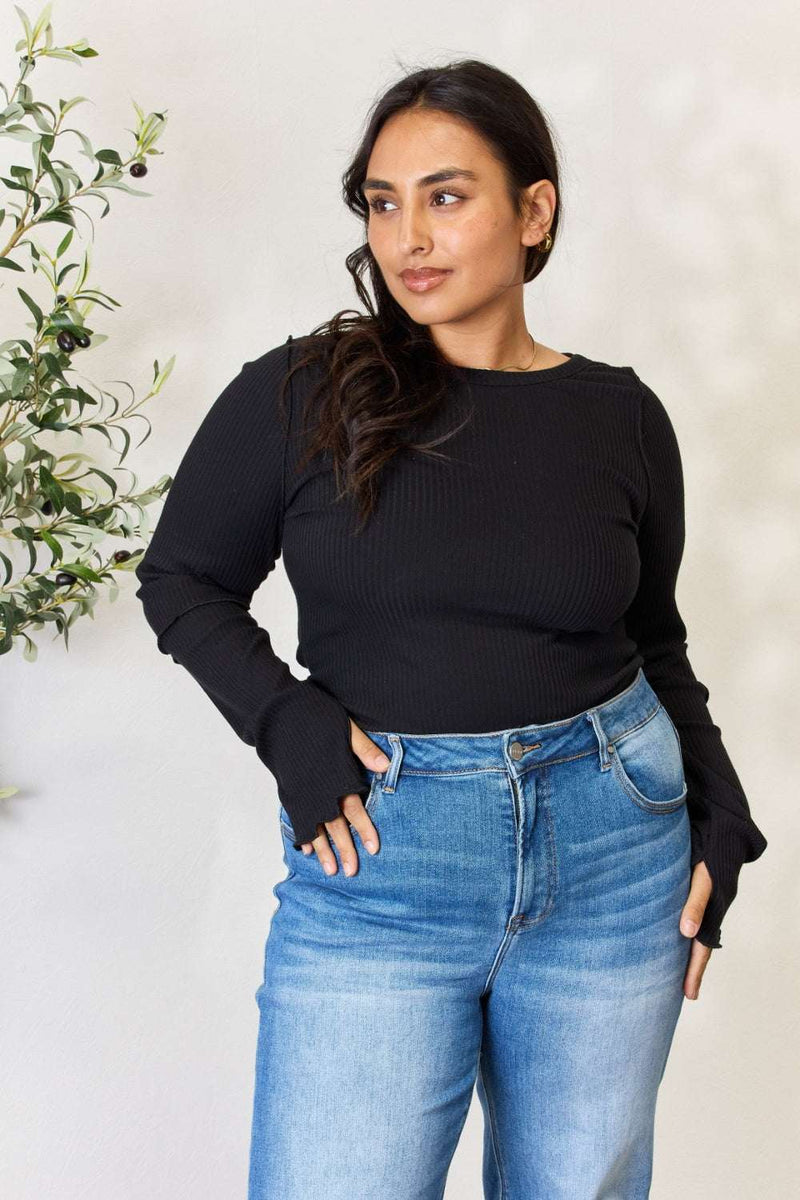 Culture Code full size ribbed round neck long sleeve top, black, modeled, with blue jeans.