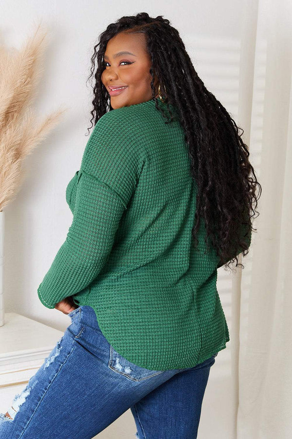 Culture Code full size scoop neck top with patch pocket in green, worn by a model.