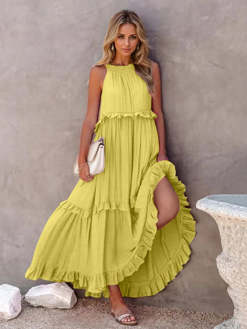 Ruffled sleeveless tiered maxi dress with high-low hem and pockets.