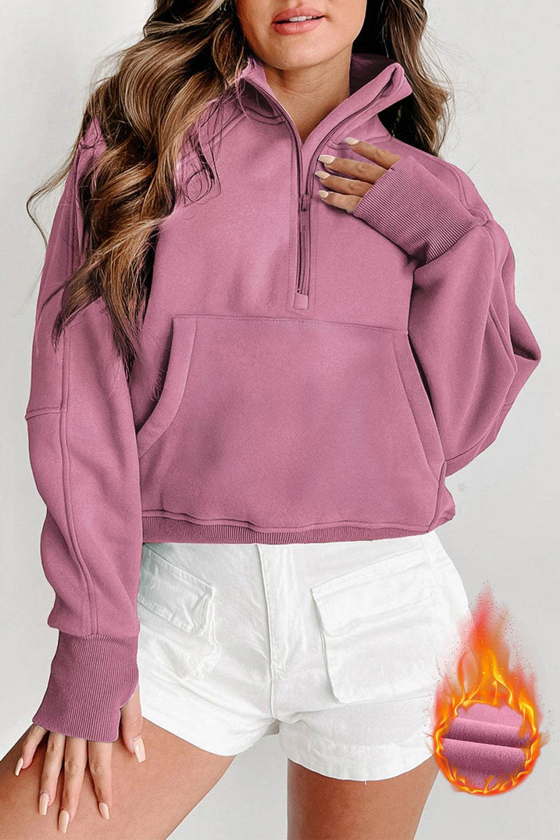Fleece lined zip up stand collar thumbhole sleeve sweatshirt for winter warmth and style.