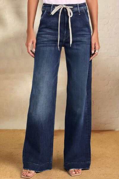 Wide leg jeans with contrast drawstring and pockets.