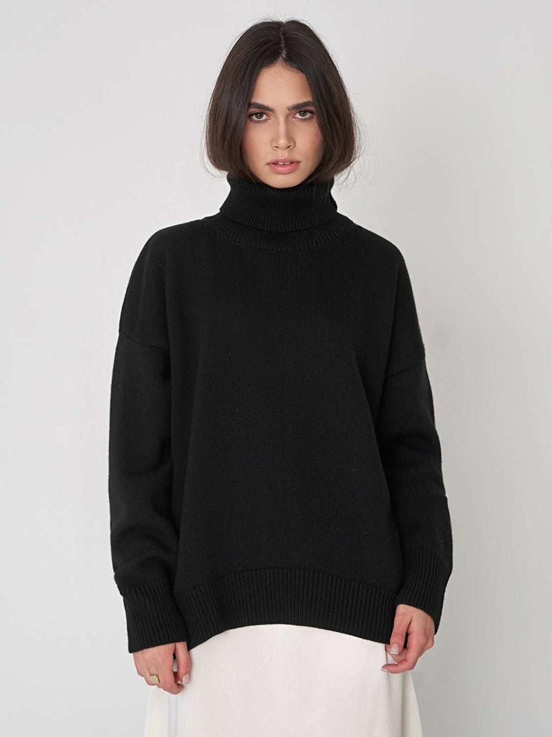 Turtleneck long sleeve sweater in black, slightly stretchy, featuring a blend of viscose, polyester, and nylon.