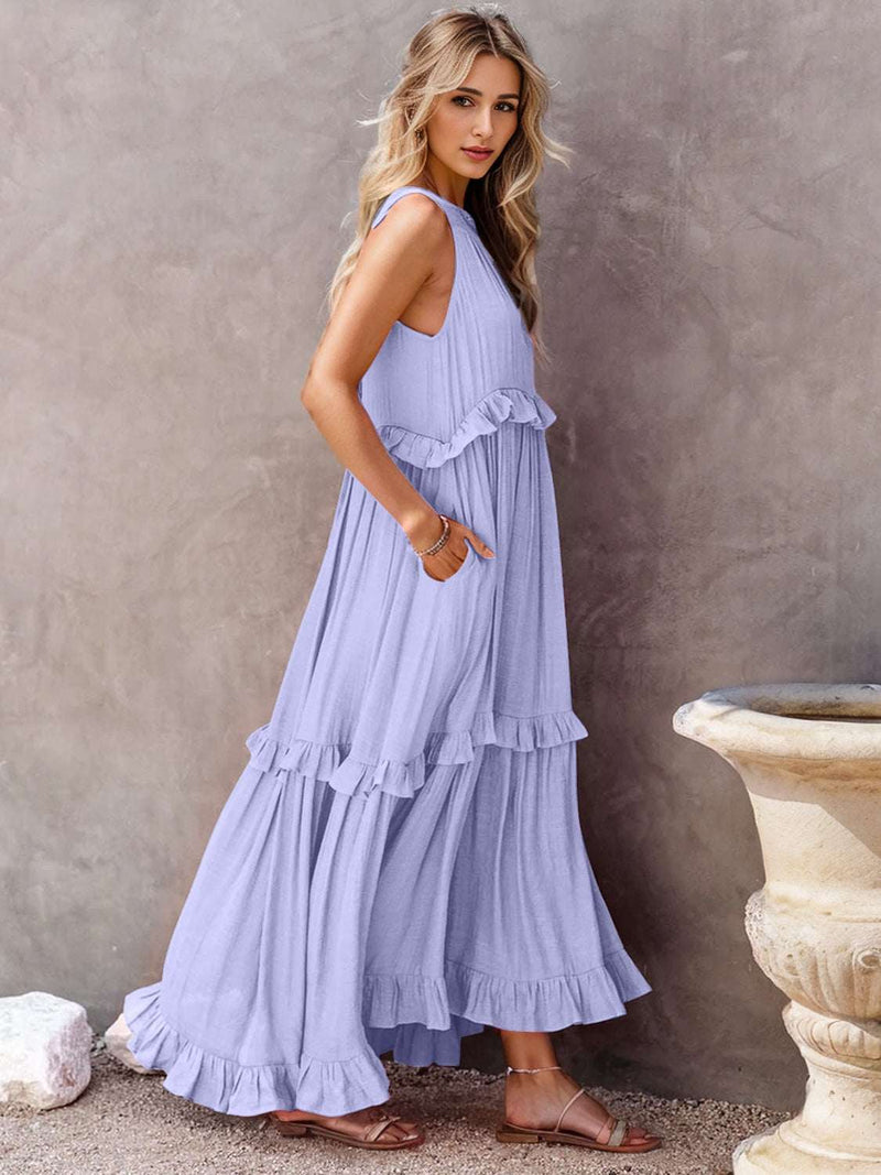 Ruffled sleeveless tiered maxi dress with ruffles and pockets.