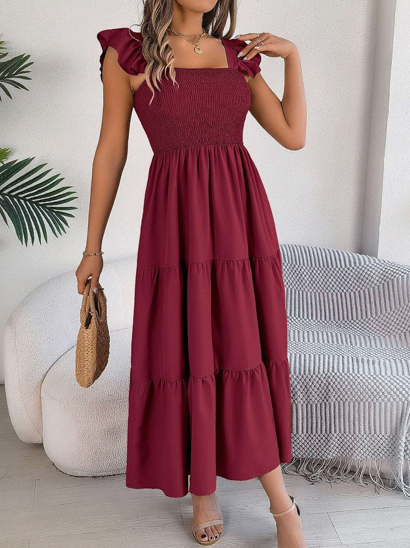 Smocked square neck cap sleeve midi dress in burgundy, featuring tiered skirt and smocked bodice.