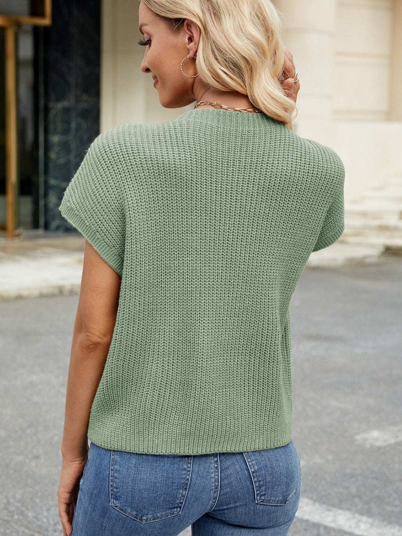 Round neck short sleeve sweater in green, slightly stretchy with pocket feature, made of 100% acrylic.