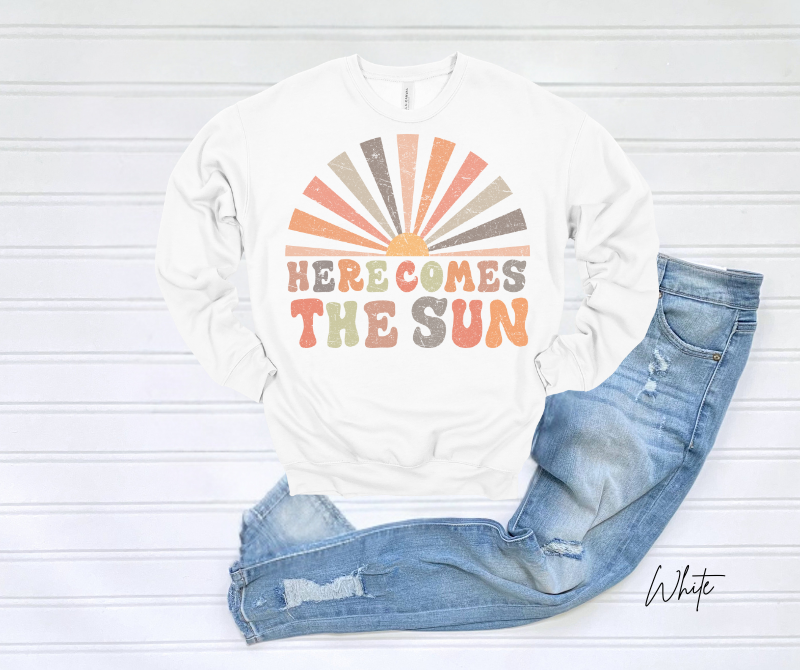 Here Comes the Sun sweatshirt with retro sunrise design.