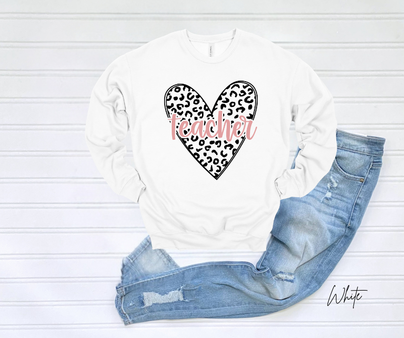 White sweatshirt with leopard heart print and "Teacher" text.