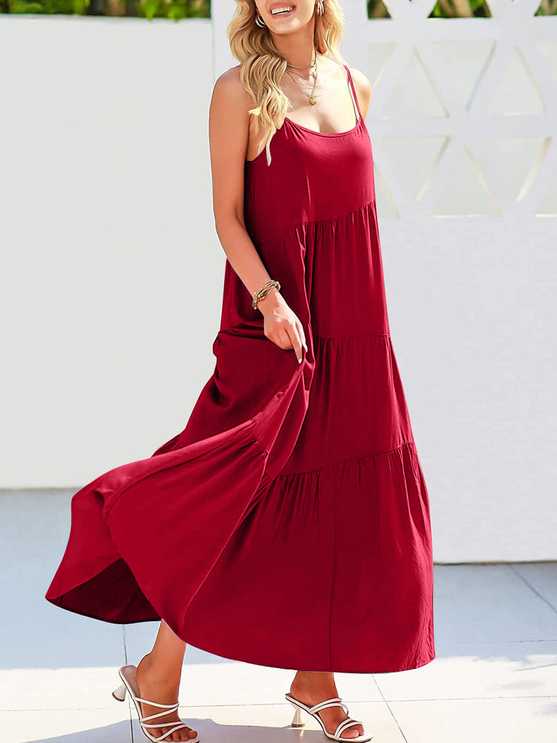 Full Size Ruched Tiered Spaghetti Strap Dress in red with moderate stretch, featuring a flowing design.