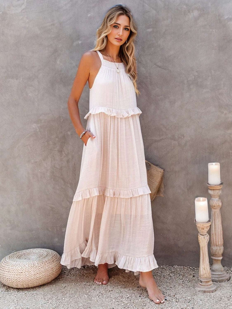 Ruffled sleeveless tiered maxi dress with pockets in light fabric.