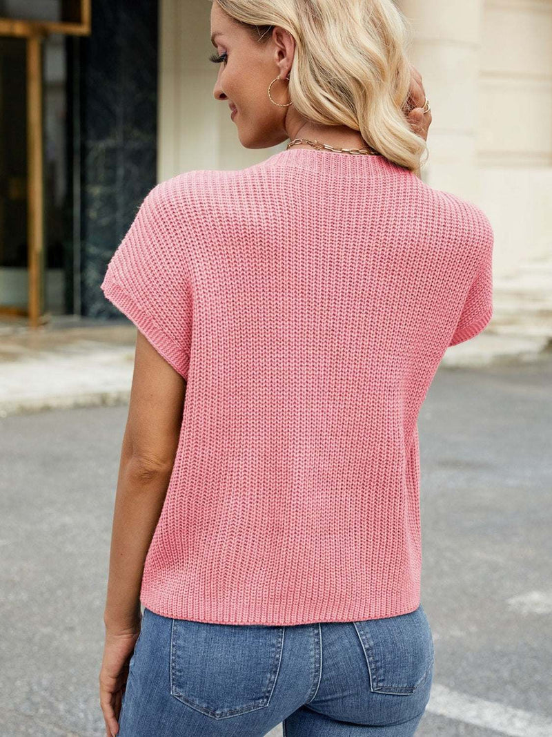 Round neck short sleeve sweater in pink, pocketed design, slightly stretchy, 100% acrylic.