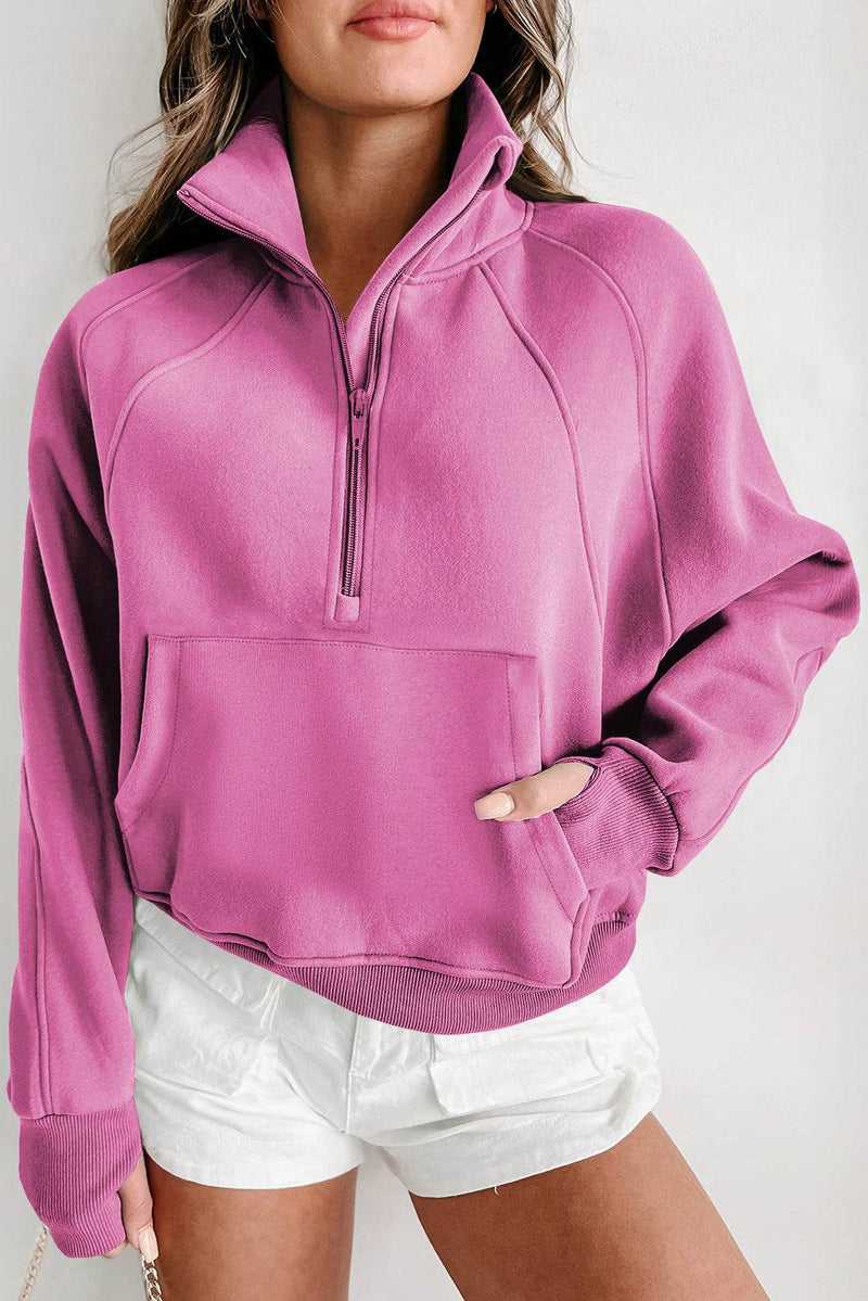 Fleece Lined Zip Up Stand Collar Thumbhole Sleeve Sweatshirt in pink, worn by a model with white shorts.