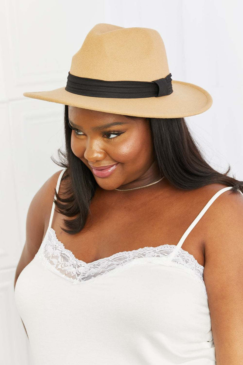 Dark tan fedora hat with black ribbon accent, perfect for outdoor and formal wear.