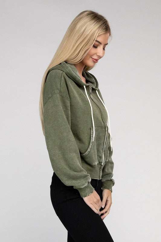 Acid wash fleece cropped zip-up hoodie with drawstring hood and pockets.