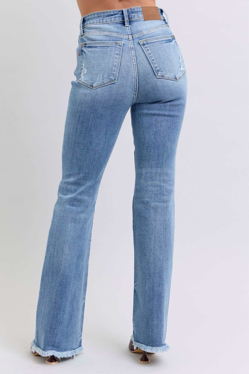 Judy Blue Full Size Raw Hem High Rise Bootcut Jeans rear view showing raw hem and bootcut style.