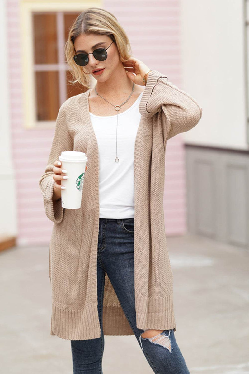 Women's open front long sleeve cardigan in beige, slightly stretchy acrylic material.