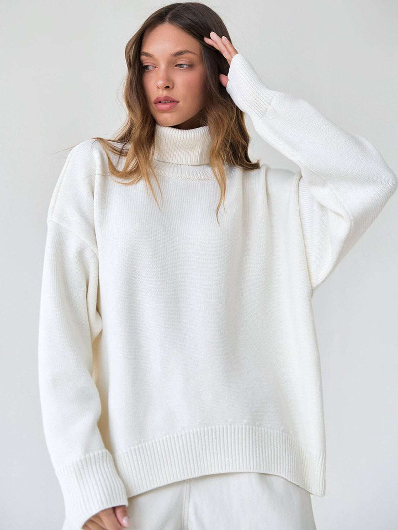 White turtleneck long sleeve sweater made of viscose, polyester, and nylon.