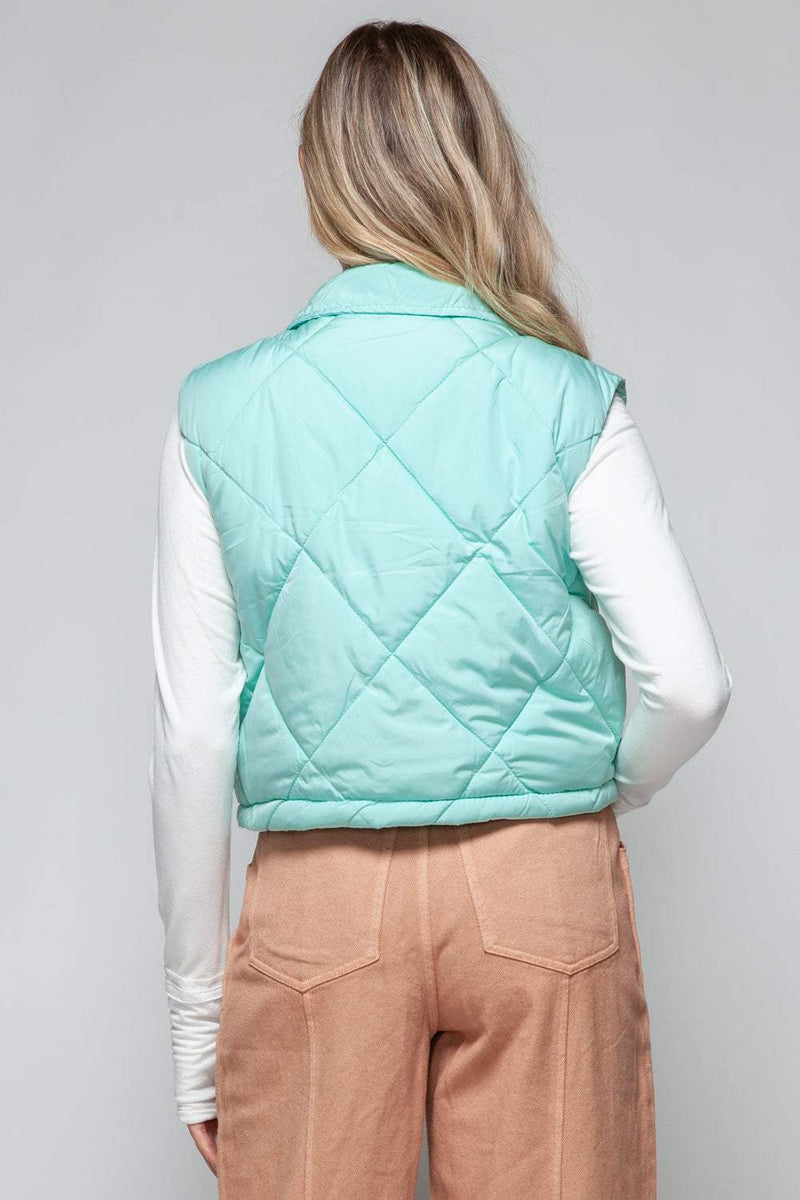 Snobbish Snap Down Quilted Crop VestThe snap-down quilted crop vest is a stylish and versatile addition to your wardrobe. With its snap-button closure and cropped length, this vest offers a modern and OuterwareTrendsiKlondike Creek Unique BoutiqueQuilted Crop Vest