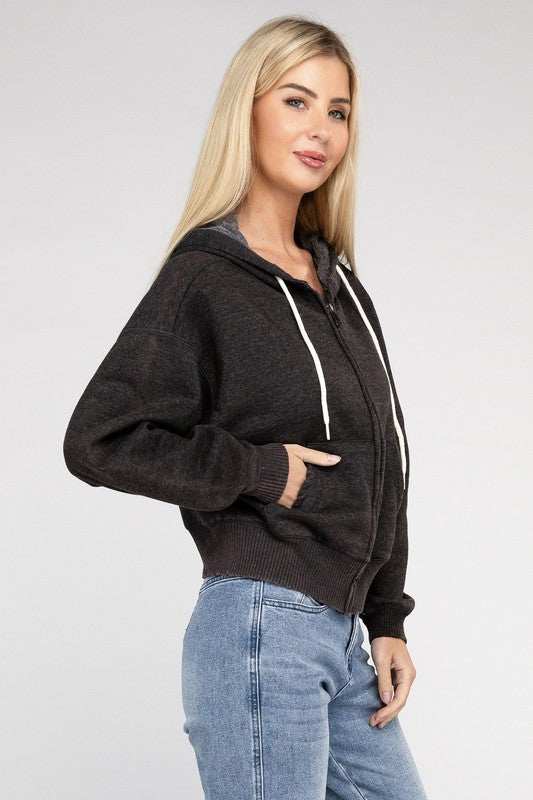 Woman wearing Acid Wash Fleece Cropped Zip-Up Hoodie with drawstring hood and pockets.