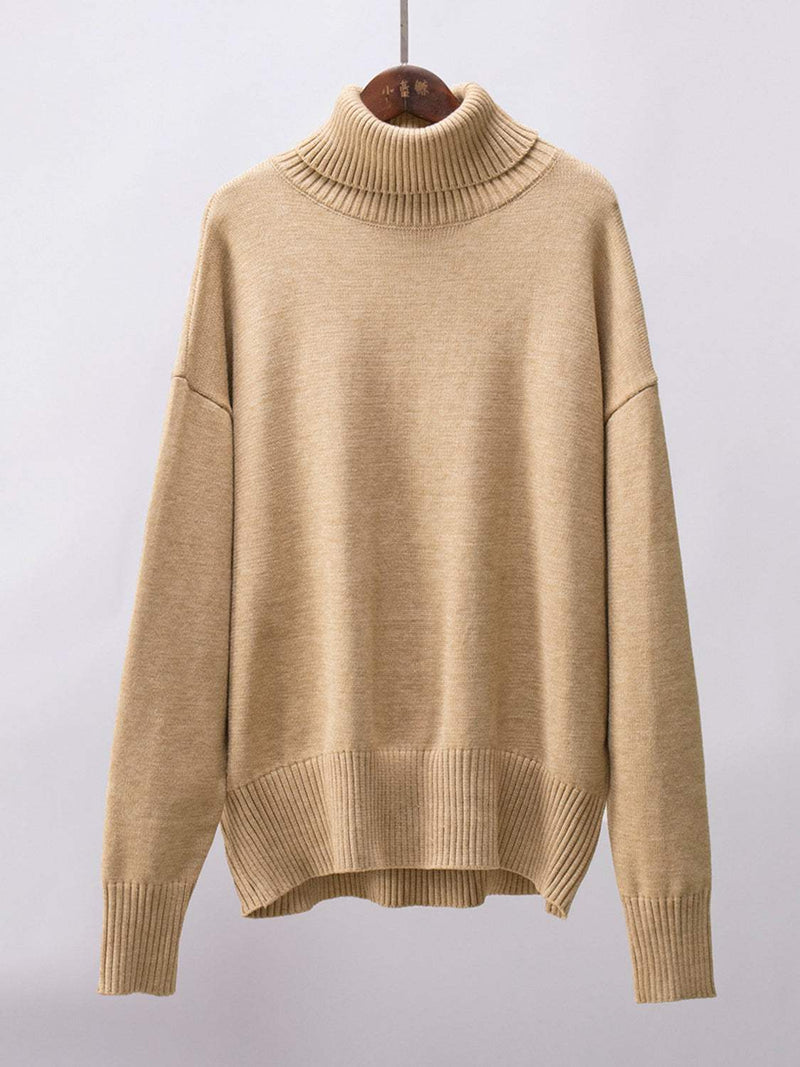 Turtleneck long sleeve sweater in beige, slightly stretchy fabric.