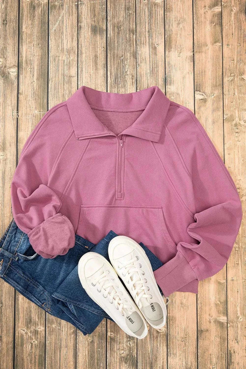 Half Zip Long Sleeve Sweatshirt in pink with denim and sneakers on wooden floor.