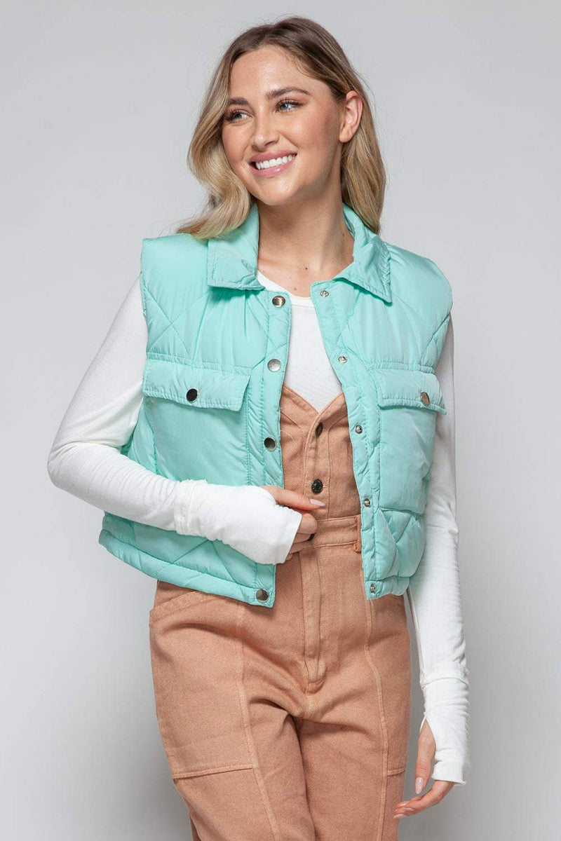 Snobbish Snap Down Quilted Crop VestThe snap-down quilted crop vest is a stylish and versatile addition to your wardrobe. With its snap-button closure and cropped length, this vest offers a modern and OuterwareTrendsiKlondike Creek Unique BoutiqueQuilted Crop Vest