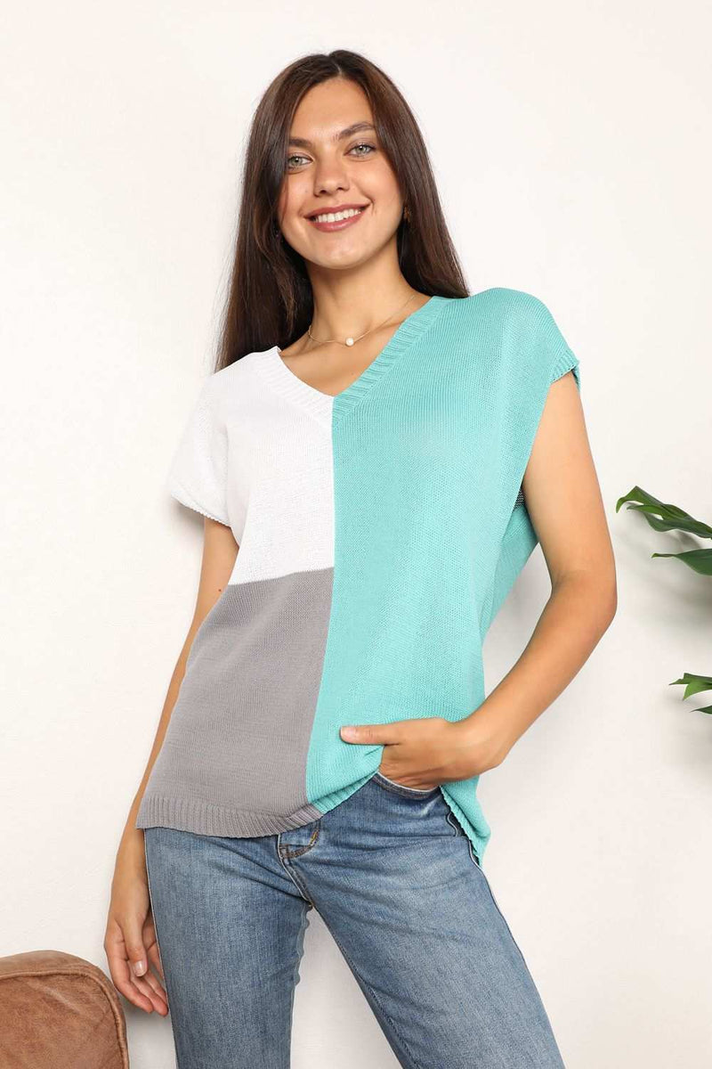 Color block V-neck knit top with short sleeves and ribbed texture.