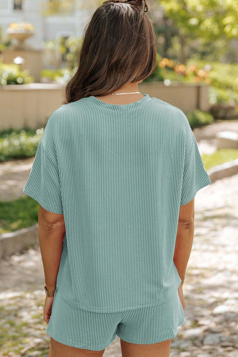 Round neck dropped shoulder top and shorts set in light blue, back view.