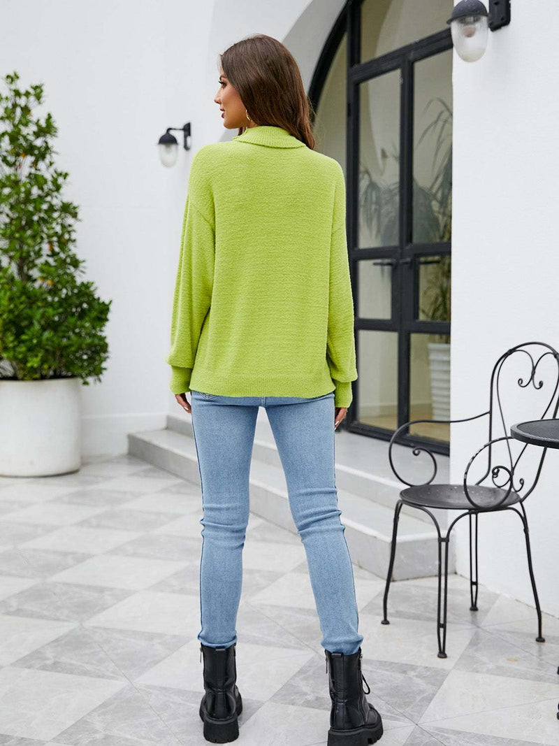 Turtleneck dropped shoulder sweater in lime green, back view.