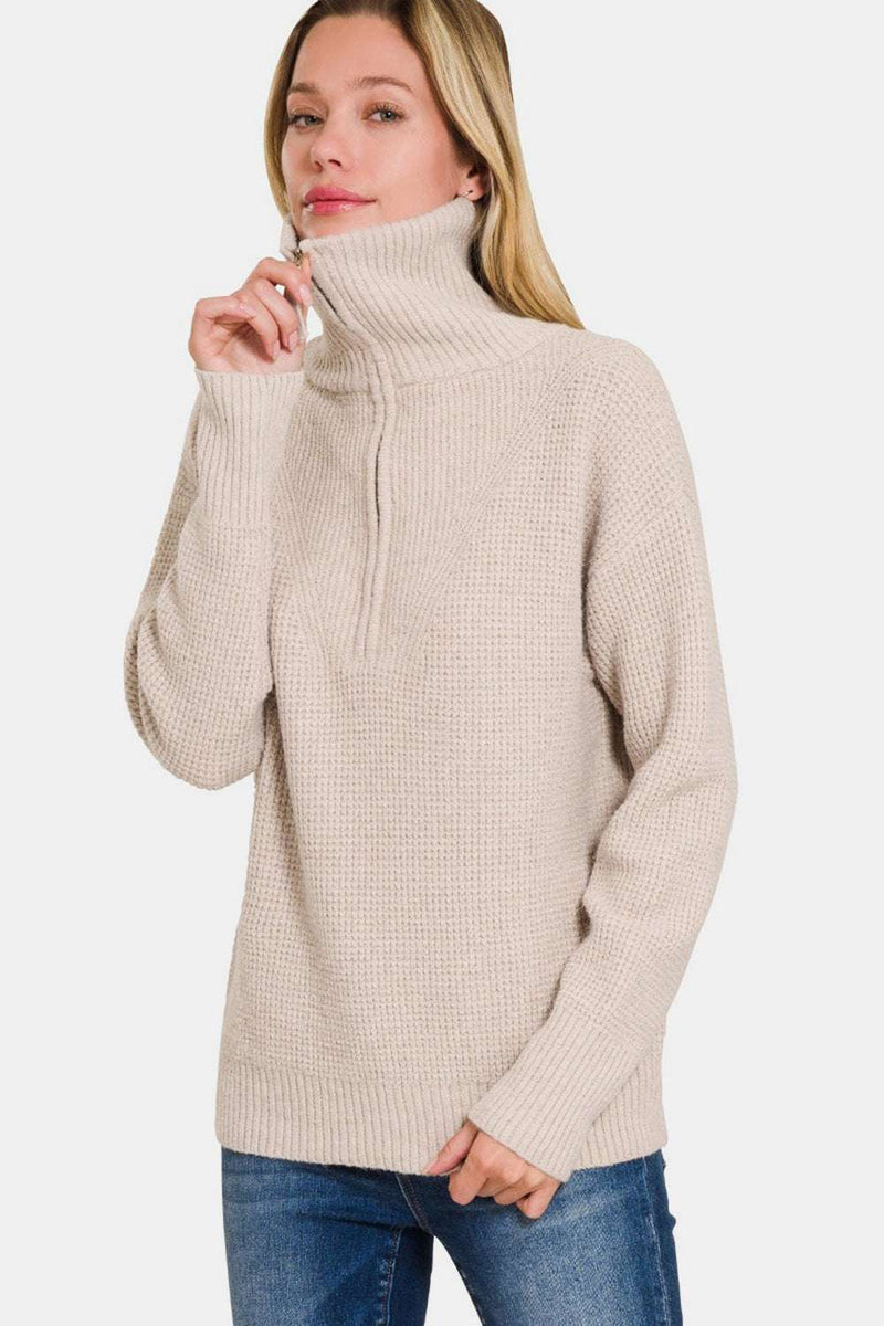 Zenana Half Zip Long Sleeve Sweater in beige, featuring a ribbed design and slightly stretchy material.