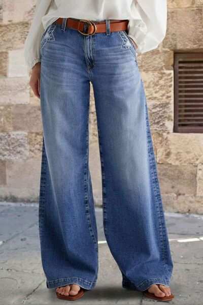 Pocketed embroidered straight leg jeans with button closure and slight stretch.