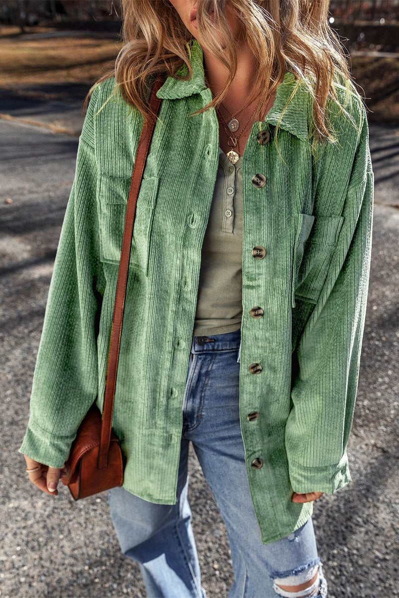 Mist green corduroy button-up shacket with patched pockets.