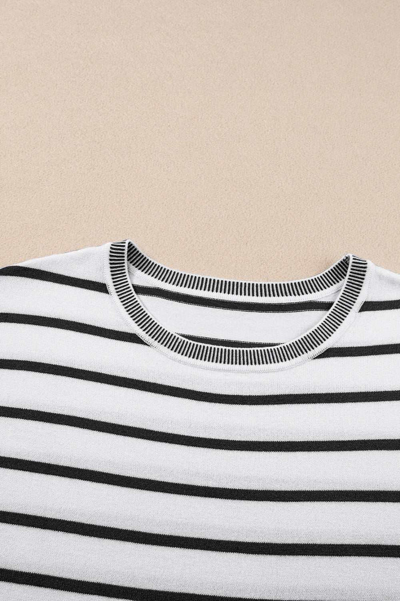 Striped round neck cap sleeve knit top in black and white pattern.