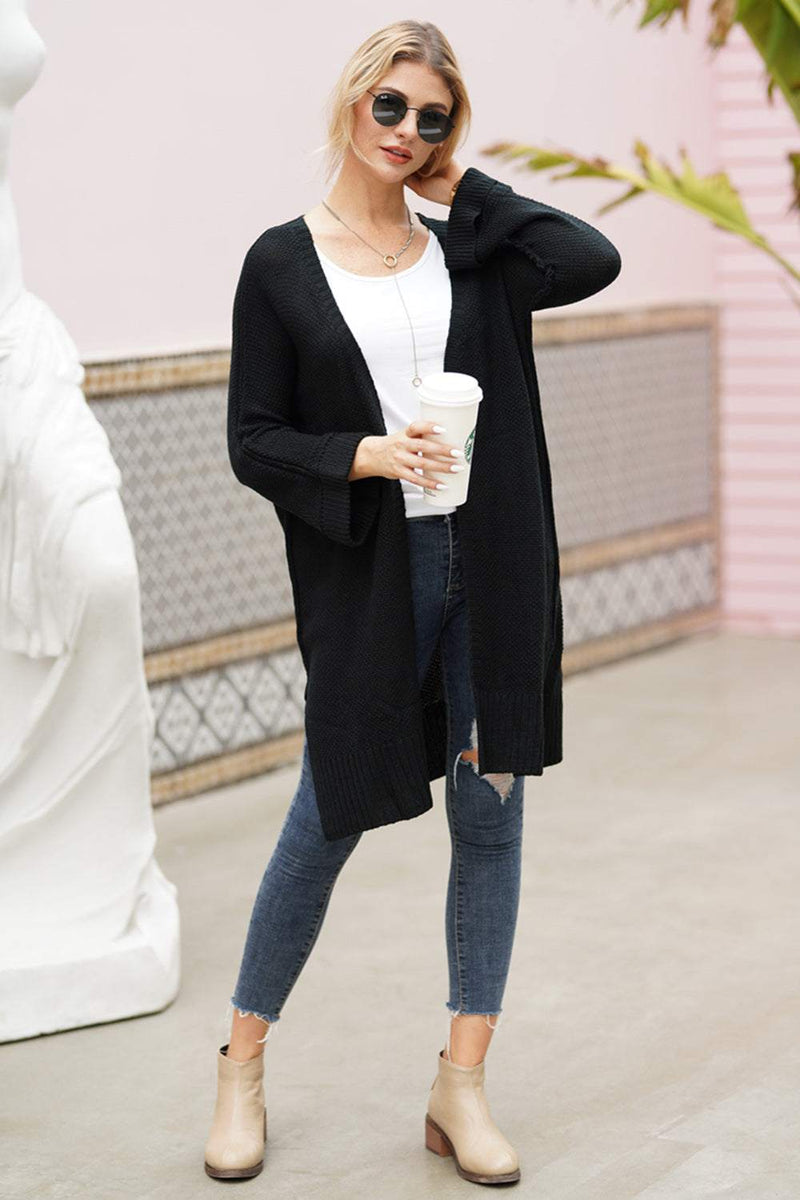Open front long sleeve cardigan in black, slightly stretchy acrylic material, modeled with casual attire.