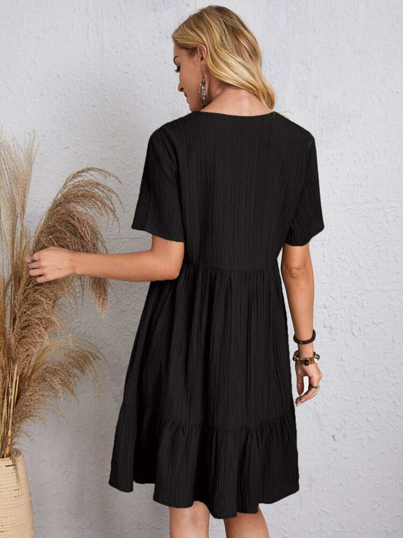 Full size black V-neck short sleeve dress, polyester, basic style, woman standing.