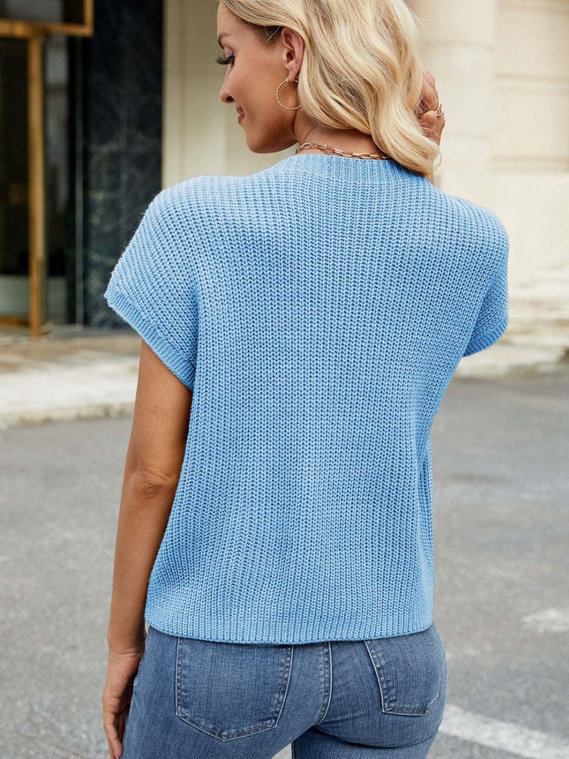 Round neck short sleeve sweater in blue with pocket detail, slightly stretchy acrylic material.