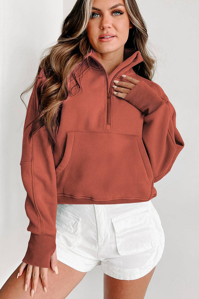 Fleece lined zip up stand collar thumbhole sleeve sweatshirt for winter warmth and style.