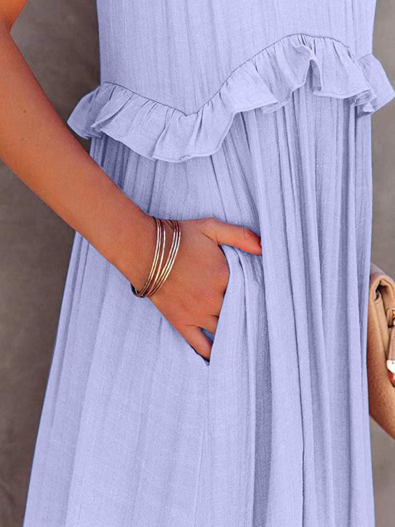 Ruffled sleeveless tiered maxi dress with pockets in light fabric.