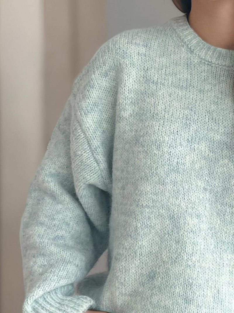 Round Neck Long Sleeve Sweater in soft fabric, perfect for warmth and style.
