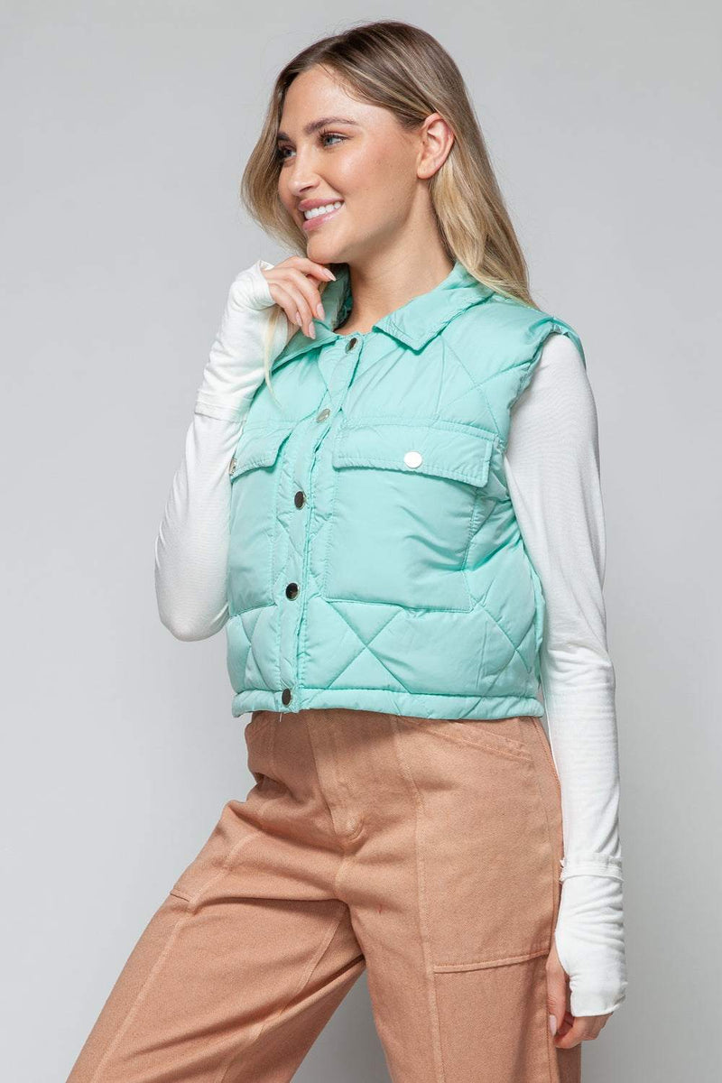 Snobbish Snap Down Quilted Crop VestThe snap-down quilted crop vest is a stylish and versatile addition to your wardrobe. With its snap-button closure and cropped length, this vest offers a modern and OuterwareTrendsiKlondike Creek Unique BoutiqueQuilted Crop Vest