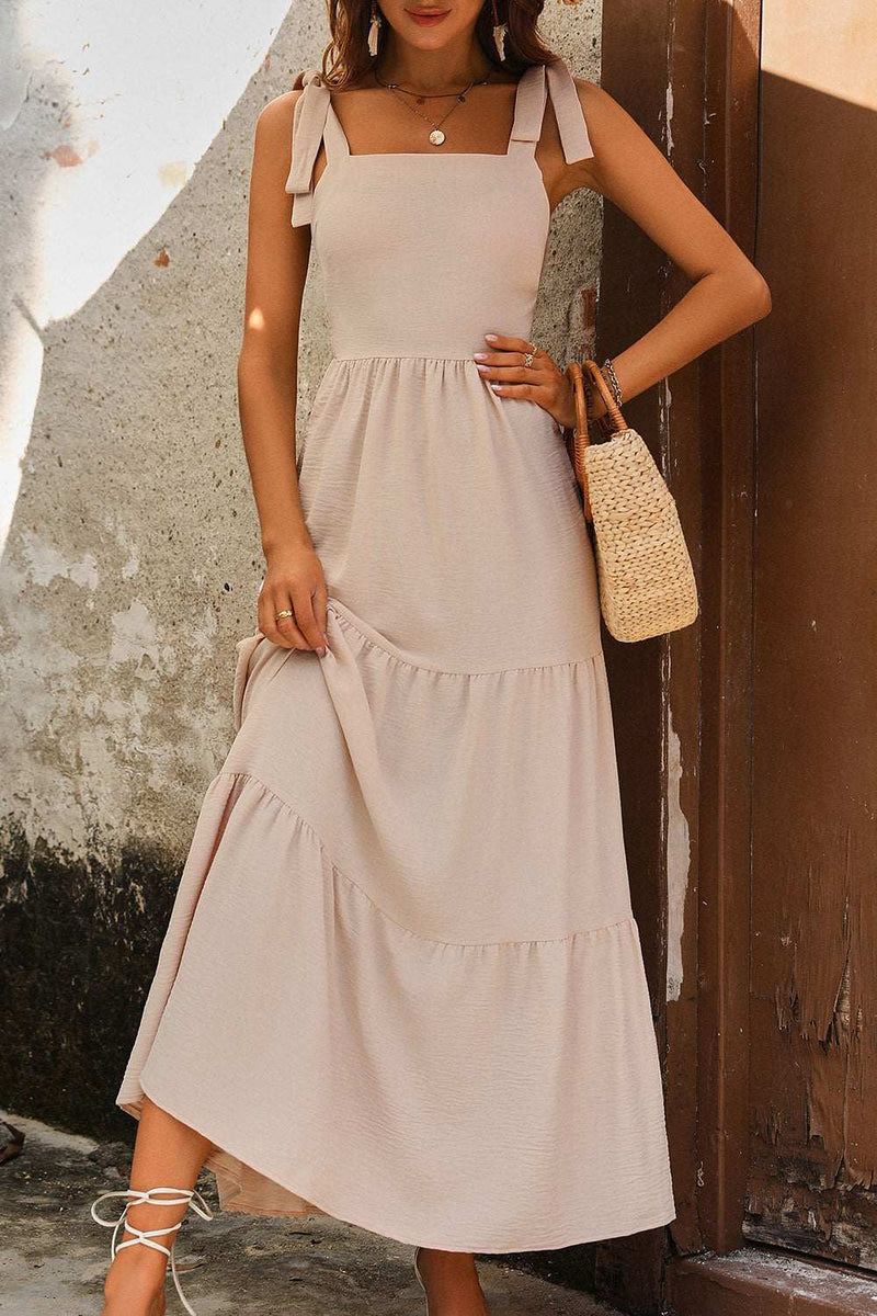 Perfee Tie Shoulder Smocked Tiered Dress in beige polyester fabric.