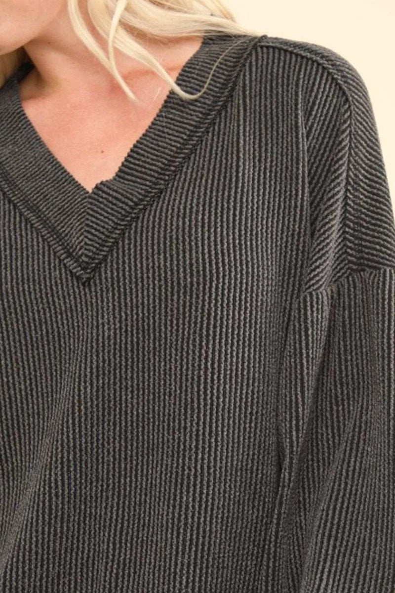 Ribbed V-neck two-tone top with exposed seam design.