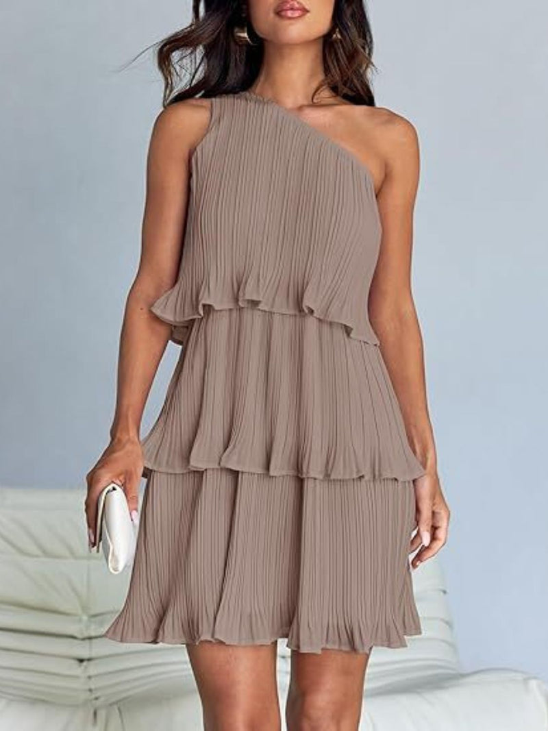 Layered single shoulder mini dress with ruffled details and slightly stretchy polyester fabric.