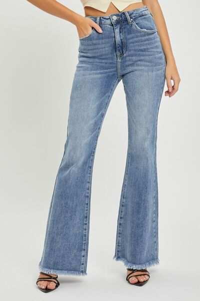 High waist flare jeans with raw hem detailing in blue denim.
