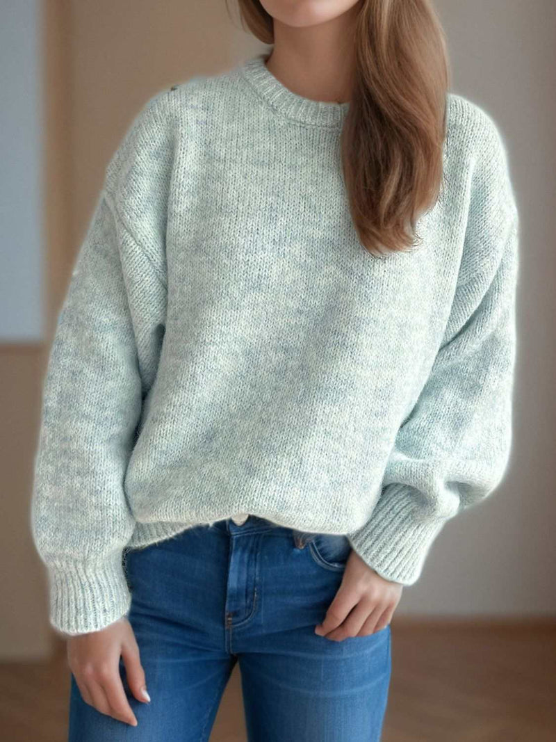 Cozy round neck long sleeve sweater in soft fabric.