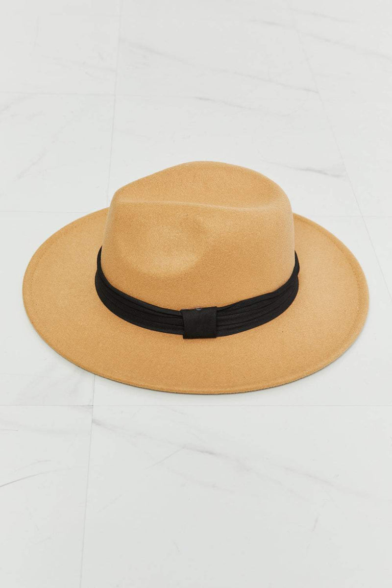 Dark tan fedora hat with black ribbon accent and adjustable straps.